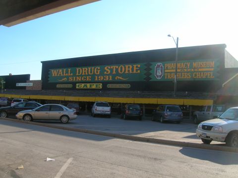 1996 Ford Bronco - Wall Drug Store, a landmark since 1931, with several vehicles parked outside on a sunny day.