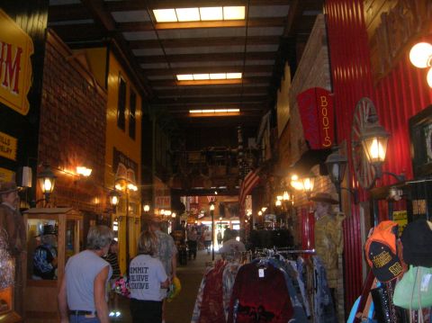 1996 Ford Bronco - A view down the aisle of a western-themed store, displays and shoppers.
