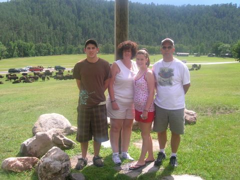 1996 Ford Bronco - A family poses for a photo in a scenic landscape with bison grazing nearby.