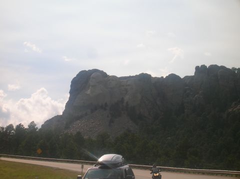 1996 Ford Bronco - A view of Mount Rushmore with vehicles passing by on the road below.