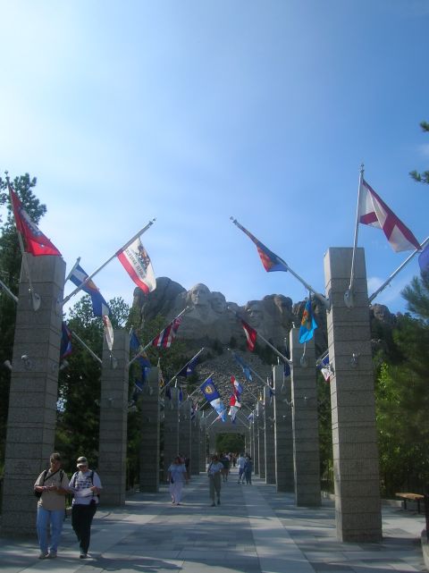 1996 Ford Bronco - Mount Rushmore National Memorial with flags lining the walkway.
