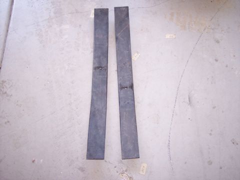 1996 Ford Bronco - Two metal bars are shown lying on a concrete surface, with a watermark at the bottom right.