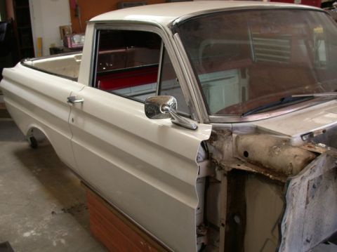 1964 Ford Ranchero - This 1964 Ford Ranchero is undergoing restoration, with its front end disassembled and the interior visible.