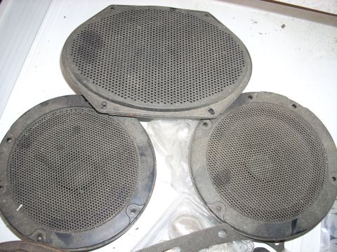 2005 Ford F-250 - Set of three used car speakers, including one oval and two round speaker grilles.