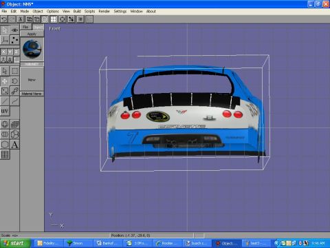 2004 Jeep Wrangler - This is a rear view of a blue and white Corvette race car, identified by the 'Corvette' text on the rear.