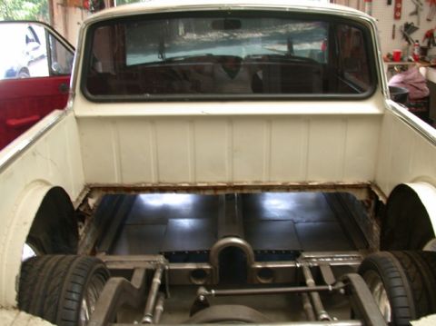 1964 Ford Ranchero - Rear view of a 1964 Ford Ranchero pickup truck, showing the bed and custom chassis modifications.