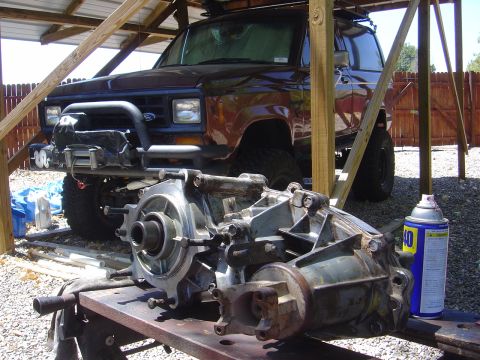 1986 Ford Bronco II - A 1986 Ford Bronco II is shown with its transmission components laid out for work.
