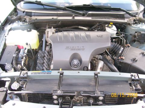 1995 Mercury Grand Marquis - Engine bay view showing the 3800 Series III V6 engine cover and surrounding components.
