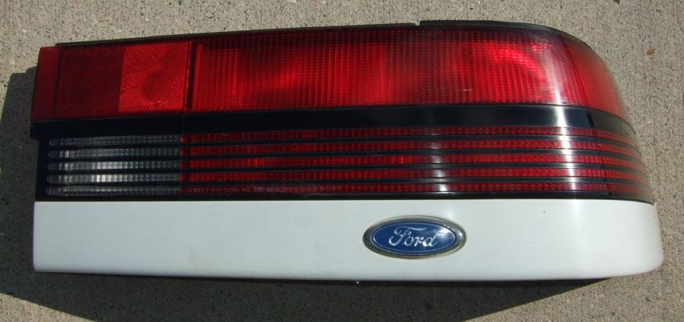 White taillight assembly with Ford badge