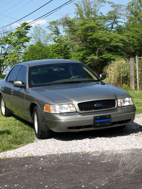 1999 Ford Crown Victoria - Gray Ford Crown Victoria parked outdoors on a sunny day.