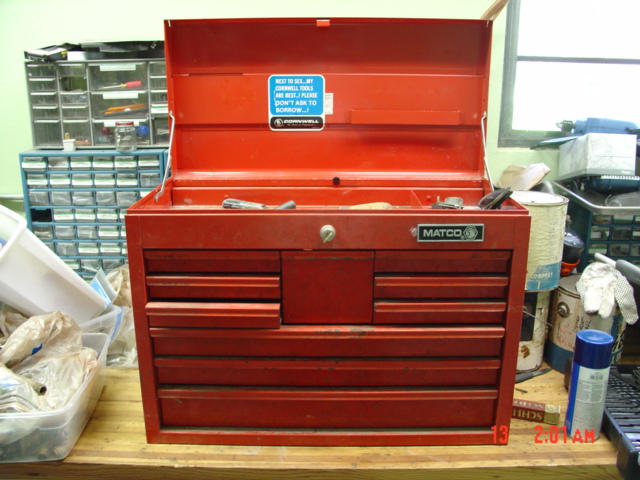 Red Matco toolbox with drawers open, tools inside. Blue sticker on lid says 'Do not ask to borrow'