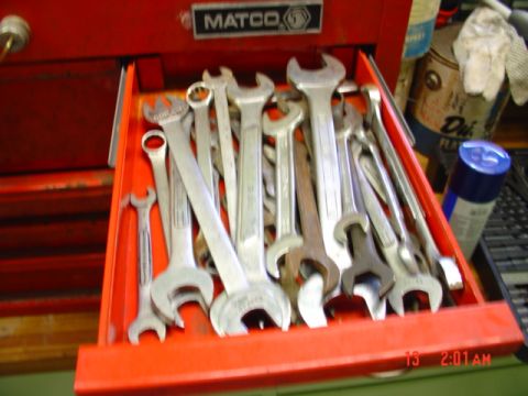 1985 Ford Bronco - A collection of wrenches is neatly organized within an open red tool drawer.