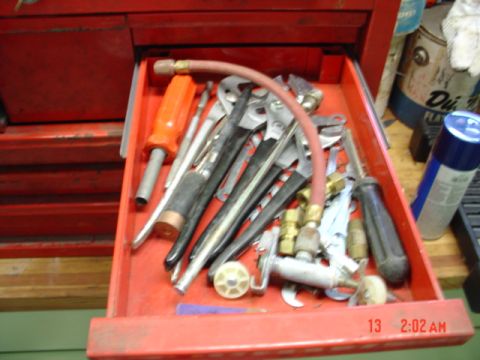 1985 Ford Bronco - Drawer of assorted tools including wrenches, pliers, and screwdrivers.
