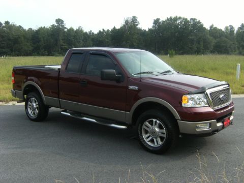 2005 Ford F-150 - This maroon 2005 Ford F-150 pickup truck is shown from the front three-quarter angle.
