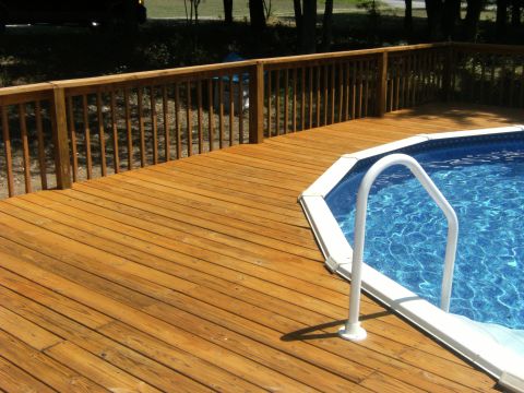 1992 Ford F-150 - Wooden deck and above-ground pool with a white ladder and railing.