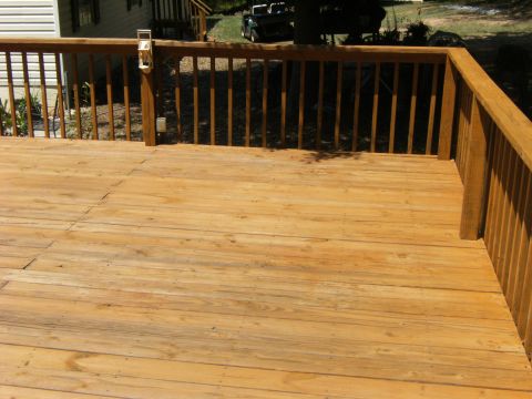 1992 Ford F-150 - A wooden deck is shown with a house and a vehicle in the distance.