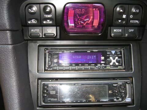 1992 Dodge Stealth - The interior of a 1992 Dodge Stealth shows its climate control panel and dual Kenwood stereo units.