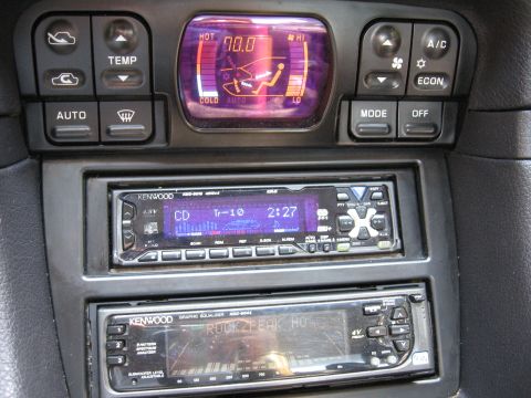 1992 Dodge Stealth - Interior view of climate controls and dual-DIN car stereo system.