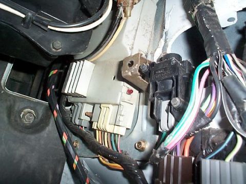 1992 Ford Bronco - Passenger side kick panel taken off, this is where the fuel reset switch is.
