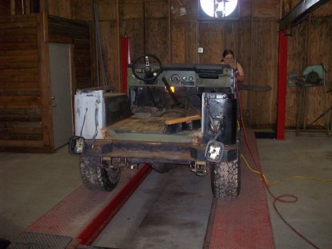 1978 Jeep CJ5 - This 1978 Jeep CJ5 is undergoing restoration in a workshop, viewed from the rear.
