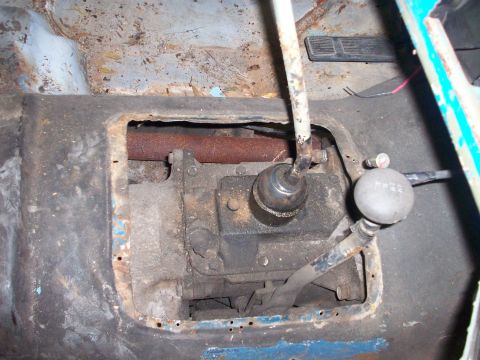 1978 Jeep CJ5 - Interior view of a 1978 Jeep CJ5, focusing on the transmission tunnel and floor pan.
