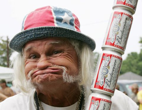 1971 Ford Ranchero - A man makes a funny face while holding a stack of Budweiser cans.