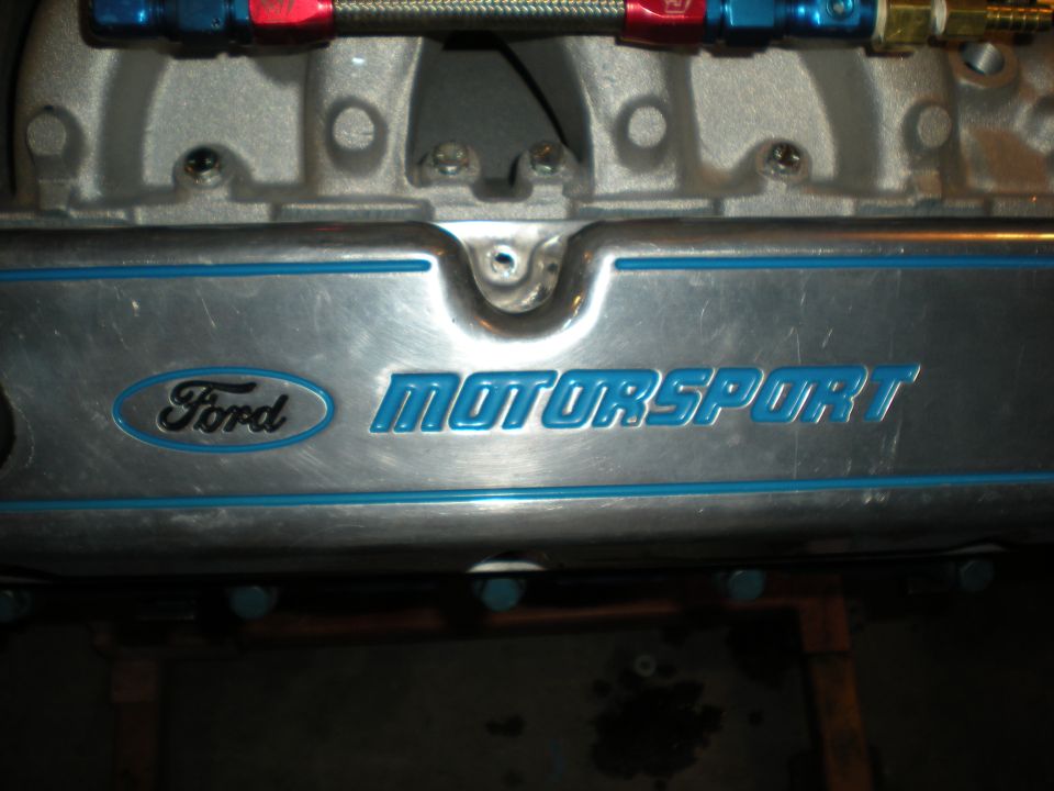 Close-up of a Ford Motorsport engine valve cover with blue lettering