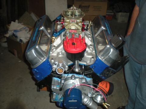 1985 Ford Bronco - A V8 engine with aftermarket parts is displayed, likely for sale or repair.