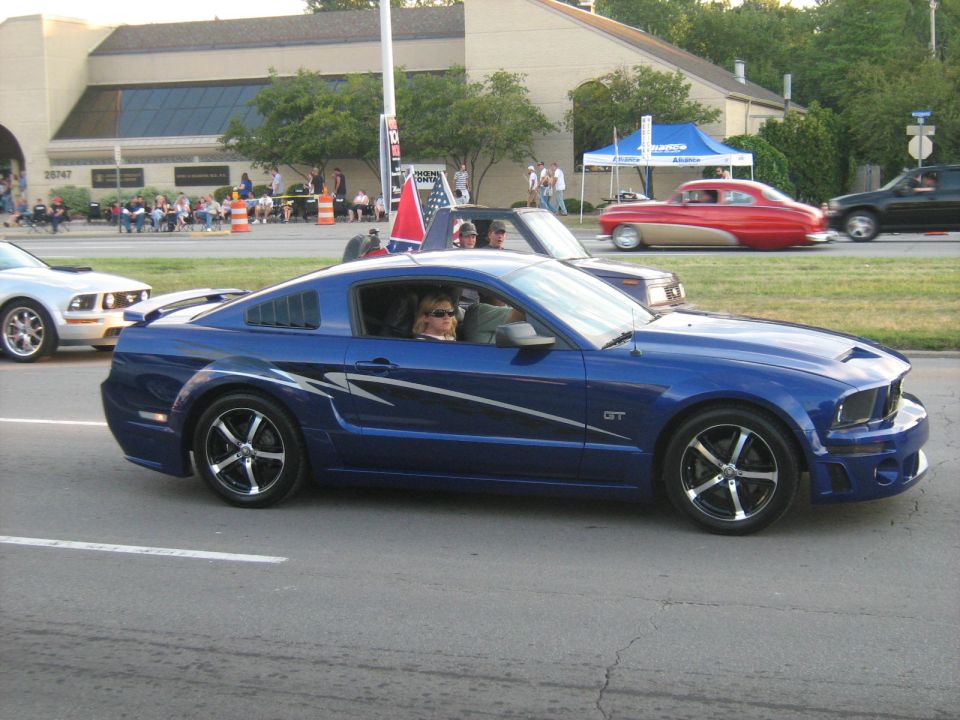 Blue Ford Mustang GT with racing stripes