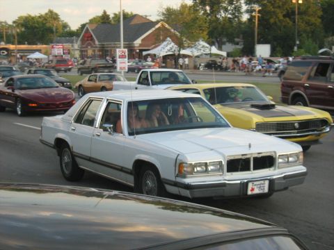 1988 Mercury Grand Marquis - crazy girls. forgot their grille.