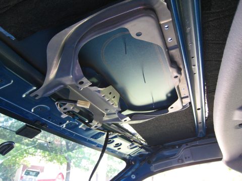 2007 Subaru Impreza - Close-up of the internal roof framework and insulation in a vehicle.