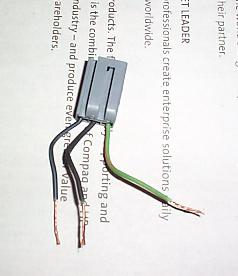 1992 Ford Bronco - This is the plug, green striped wire goes to the green striped one. Make sure you have the light grounded before putting the fuse back in.