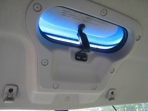2007 Subaru Impreza - A car's interior roof vent is shown with visible Japanese text and a blue light.