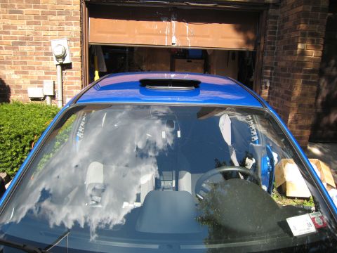 2007 Subaru Impreza - Front view of a blue 2007 Subaru Impreza, highlighting the roof vent and interior details.