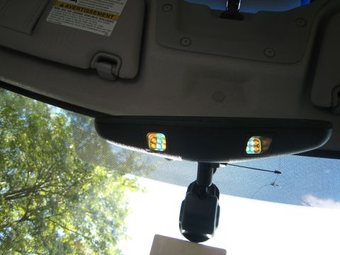 2007 Subaru Impreza - Interior rearview mirror with illuminated lights visible.
