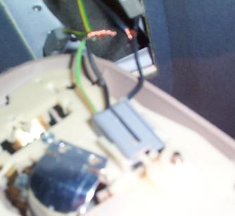 1992 Ford Bronco - Close-up view of the interior lighting wiring and connector, with some exposed copper.