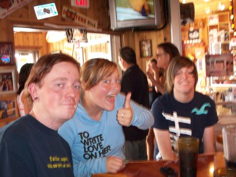 1996 Ford Bronco - A group of friends enjoy themselves at a bar, with a license plate and exit sign in the background.