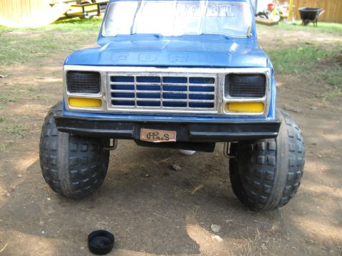 1994 Ford Bronco - This blue toy truck features a prominent Ford grille and oversized tires, suggesting a Power Wheels model.