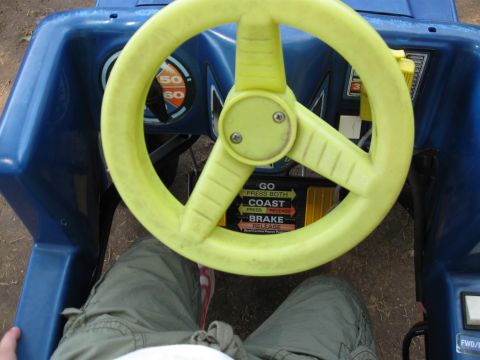 1994 Ford Bronco - Interior view of a blue toy car with a yellow steering wheel and visible controls.
