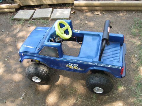 1994 Ford Bronco - This is a blue plastic toy truck with "All Terrain Battery Power" text on the side.