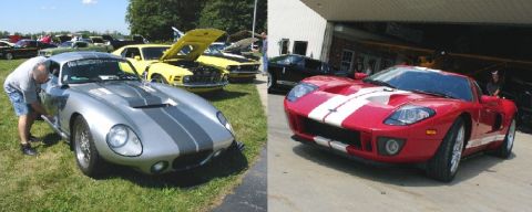2003 Ford Crown Victoria - A red 2005 Ford GT with white stripes is parked in front of a garage, with other cars visible in the background.