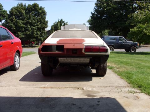 1978 Ford Mustang II - This 1978 Ford Mustang II is seen from the rear, showing its primer finish and taillights.