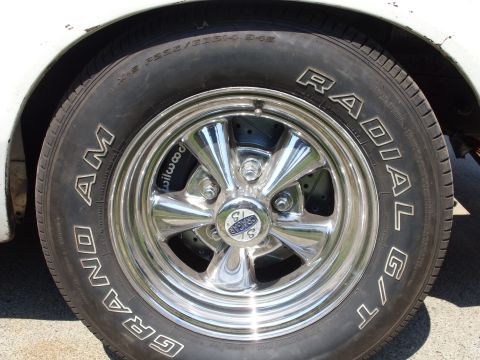 1978 Ford Mustang II - A chrome wheel with a performance tire and visible brake caliper is shown.