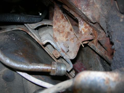 1984 Ford Bronco - Passenger side mount installed. You have to elongate the subframe hole under this mount. The motor mount bolts will hit the subframe if you…