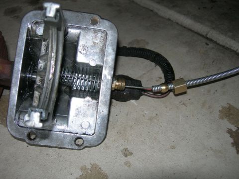 1991 Jeep Wrangler - Close-up view of a transfer case shifter mechanism, showing the internal spring and cable linkage.