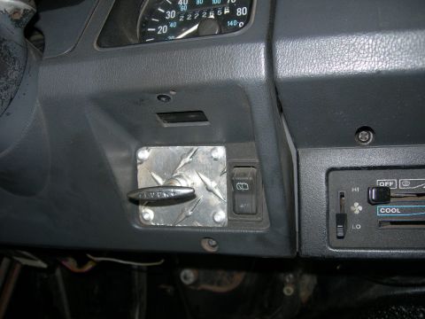 1991 Jeep Wrangler - Dashboard interior of a 1991 Jeep Wrangler, an aftermarket switch and climate controls.