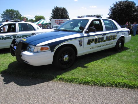 1991 Ford LTD Crown Victoria - white and blue Ford Crown Victoria police cruiser lettered POLICE and Western New England College with a roof lightbar.