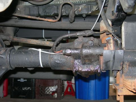 1991 Jeep Wrangler - Undercarriage view of a vehicle's steering box and axle components, showing wiring and mechanical parts.