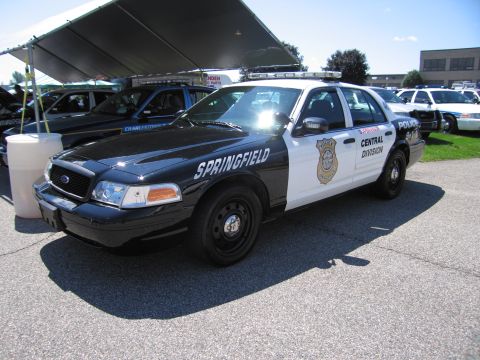 1991 Ford LTD Crown Victoria - black-and-white Ford Crown Victoria cruiser lettered SPRINGFIELD POLICE Central Division under a tent at a car show.
