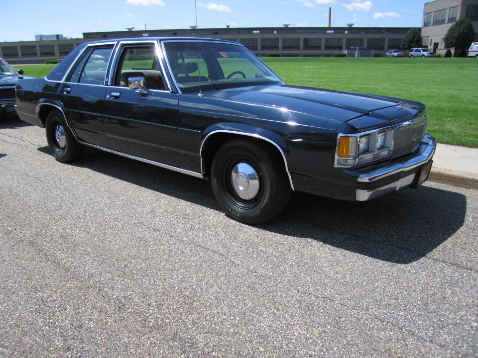 Dark blue Ford LTD Crown Victoria sedan parked on pavement